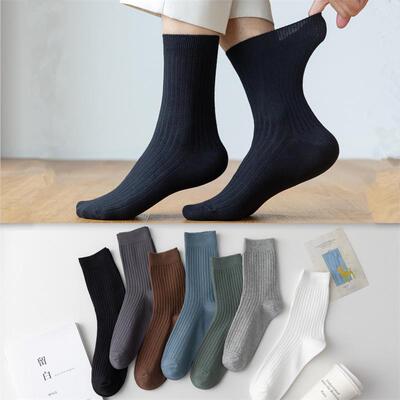 Hes a man in a pair of red-coloured mens socks, a man in c