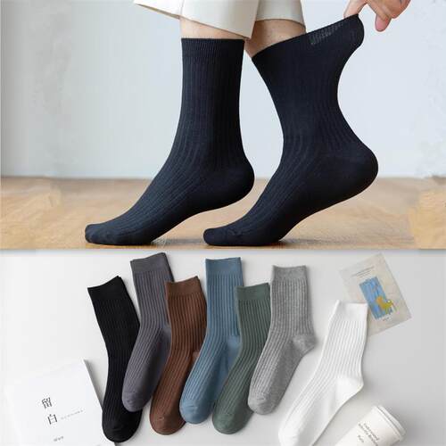 Hes a man in a pair of red-coloured mens socks, a man in c