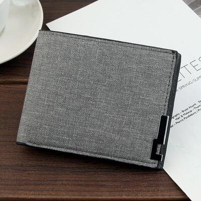 A mans short wallet, a lot of money in a knapsack.
