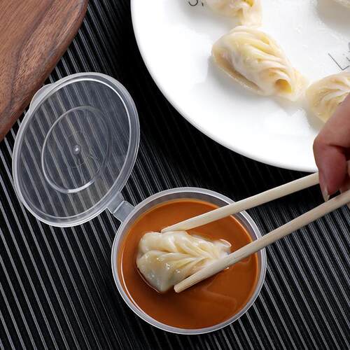 A one-time plastic round sauce box for the sauce cup.