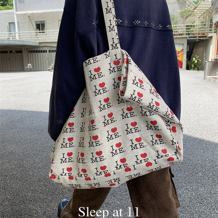 韩版通勤减龄百搭字母爱心印花帆布托特包大容量轻便休闲单肩包女,箱包皮具/热销女包/男包,托特包,淘宝优惠券,粉丝福利购,淘宝优惠卷