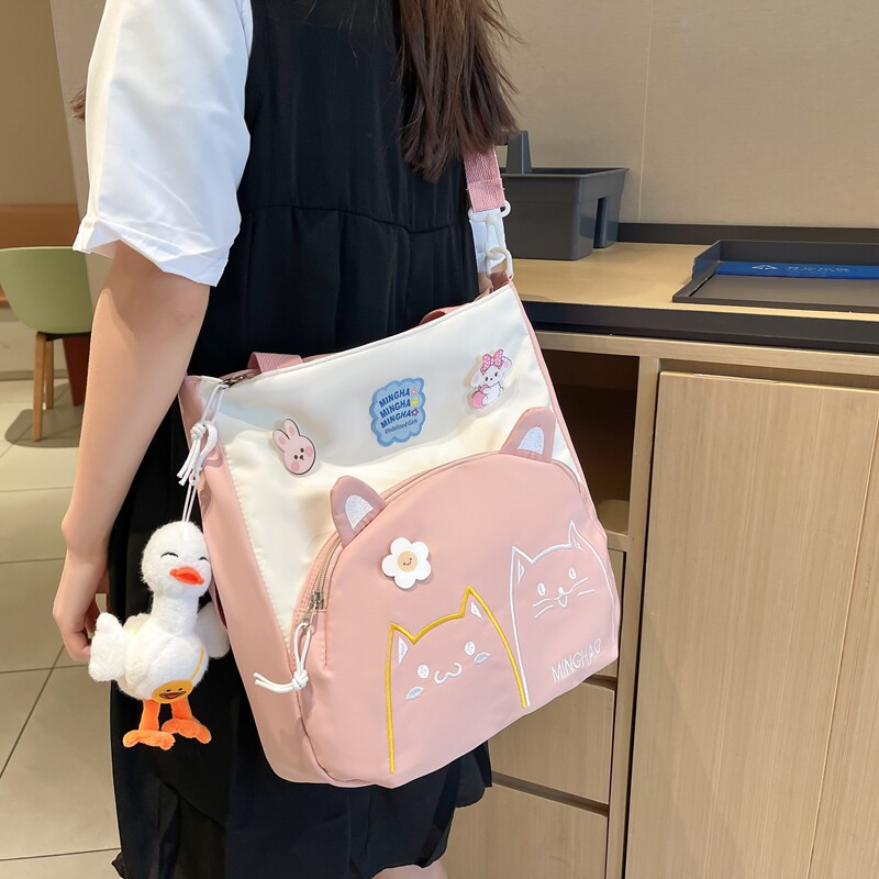 斜挎书包小学生女2022新款女童轻便手提袋小背包女孩补课单肩挎包
