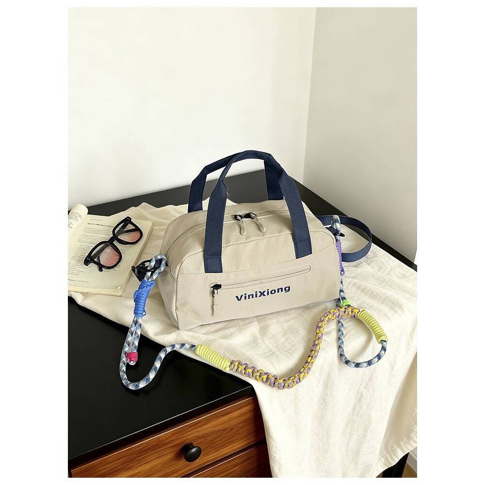 专柜品牌日系登山骑行运动健身包单肩包尼龙休闲多色情侣斜挎保龄