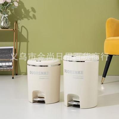 Dual-compartment trash bin with lid, featuring a foot pedal