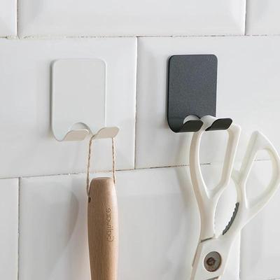 Wall-mounted multifunctional storage hook for power plug and