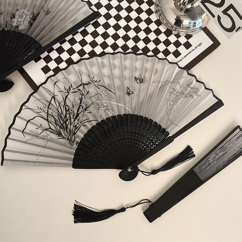 A portable Chinese-style folding fan with a vintage look p