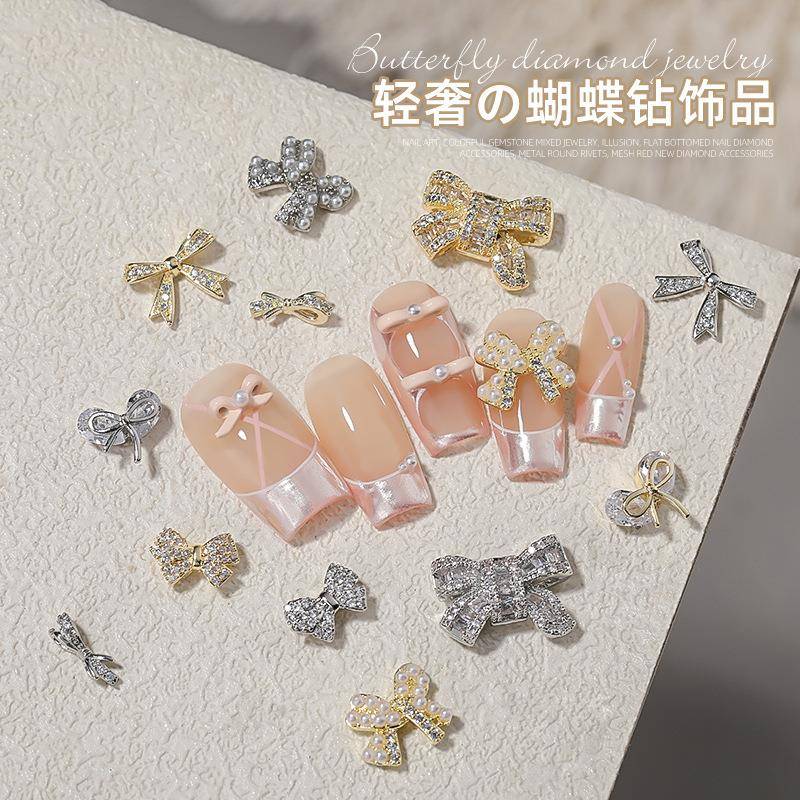 美甲蝴蝶结锆石饰品爆闪镶钻指甲饰品高保色镀金工艺125流行配