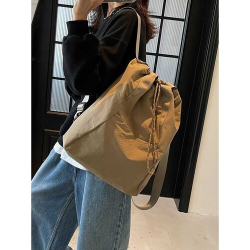 品牌官方背包旅行休闲寸女款斜挎包抽绳束口包大容量双肩包山系