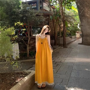 慵懒松弛感黄色流苏吊带显白连衣裙海边度假气质长裙绝美沙滩裙夏