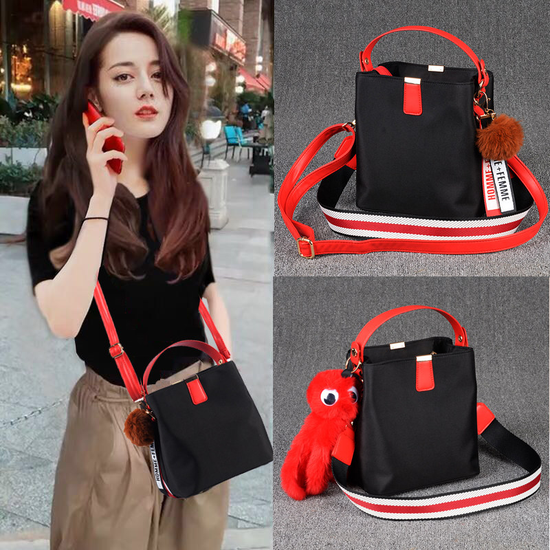 包包女斜挎包牛津布单肩包休闲时尚尼龙布手提包帆布百搭水桶包小