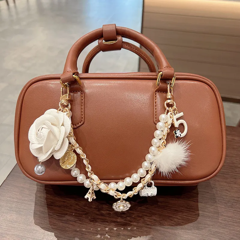 时尚水貂毛皮质山茶花手提包包挂链网红爆款创意精致包包挂饰