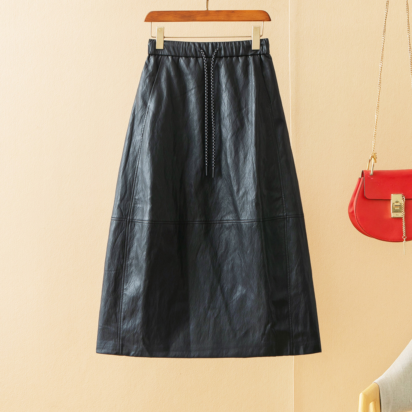 蛮文 洋气上档次 柔软筋骨感金属丝蛋白皮中长款A字花苞半裙5A235