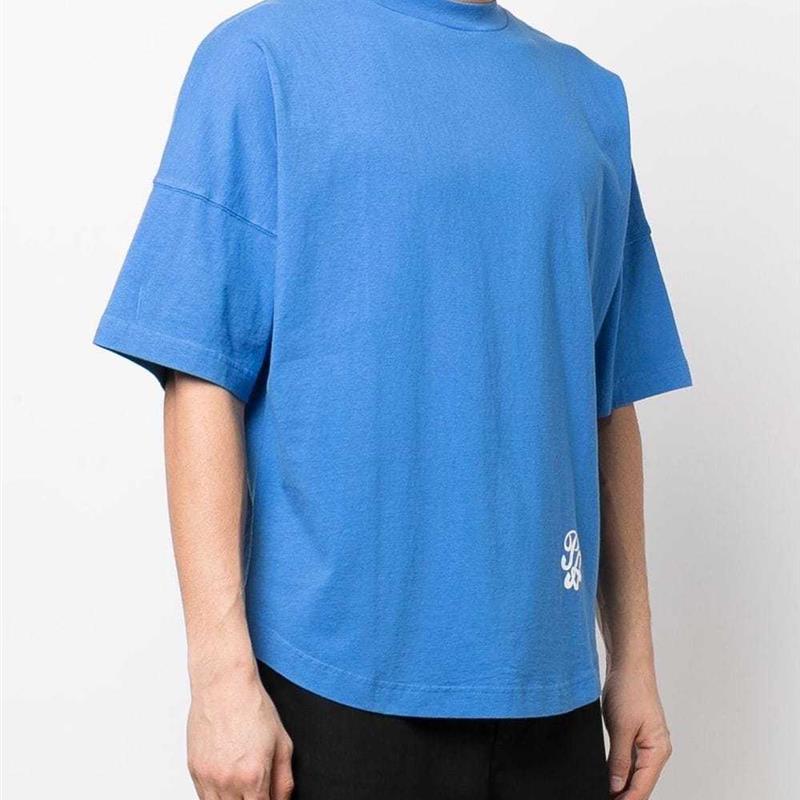 The Tide Palm Angels Logo is on his shoulder and loose shor