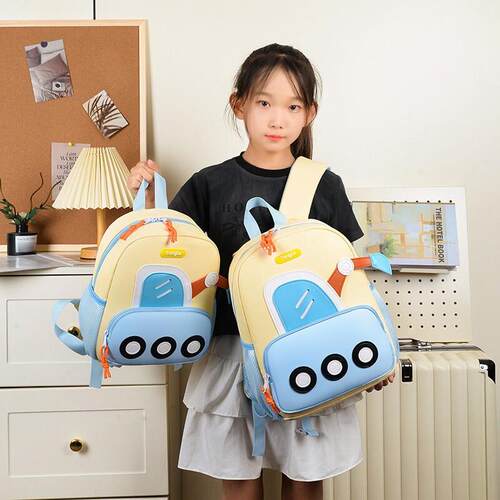 Kid with two shoulder bags of children walking out of an exc