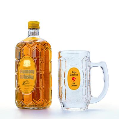 A glass of wine and a trinity with a beer and a cup of tea a