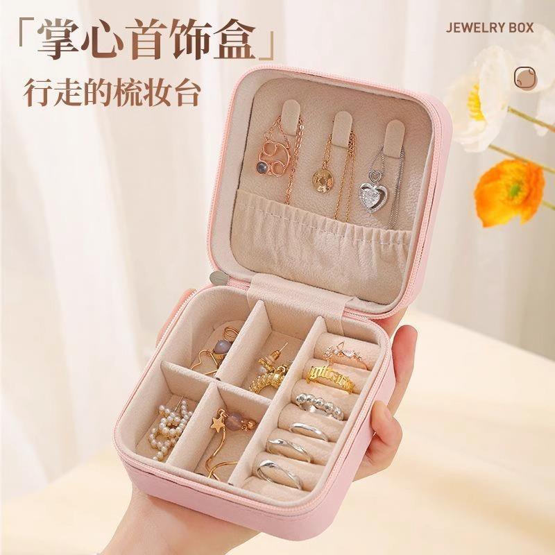 Portable jewelry box for storing earrings, necklaces, and ri