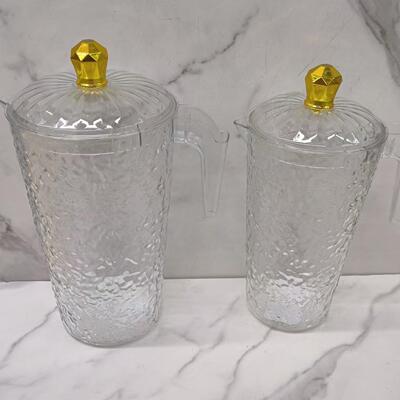1 pitcher with 4 cups, made of clear plastic, featuring a li