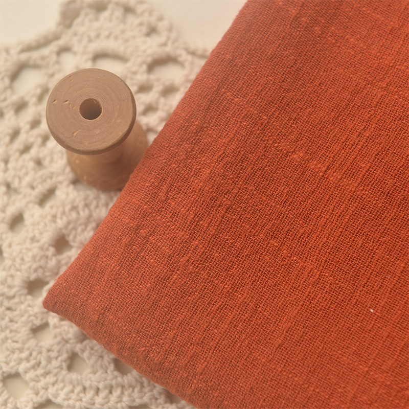 禅意砖红色砂洗竹节棉麻长袍面料