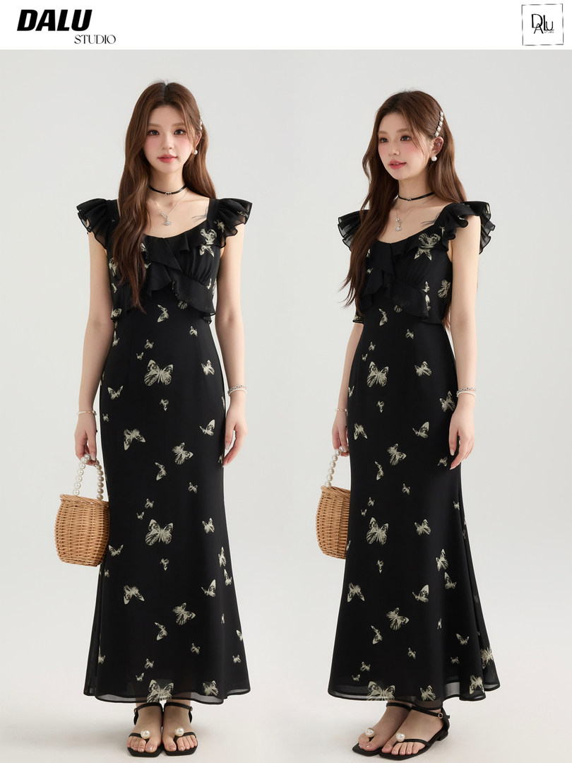Black butterfly-print ruffled maxi dress worn by a model