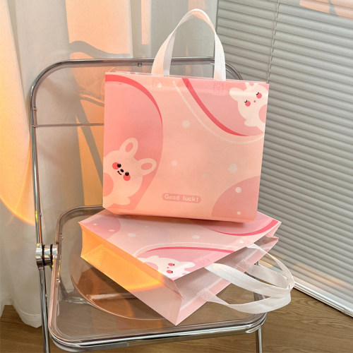 工厂批发新款覆膜可爱兔女装用服装店礼品店无纺布手提袋定制logo