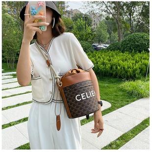 赛林凯旋门包包2024秋冬新款麻绳老花水桶包大容量单肩腋下包女包