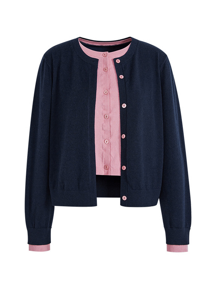 Navy and pink button-front cardigan sweater on a white background