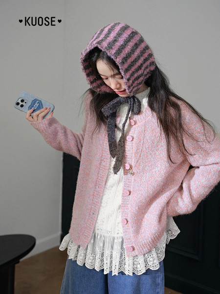 Pink striped hooded knit cardigan worn by a model