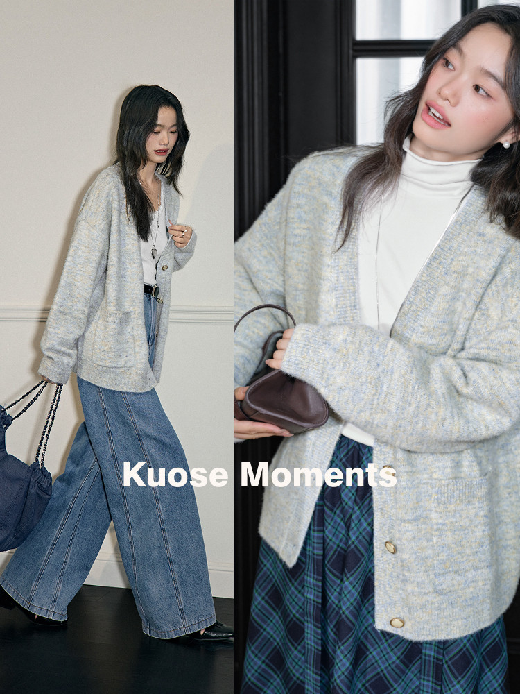 Model wearing a light gray oversized knit cardigan with jeans