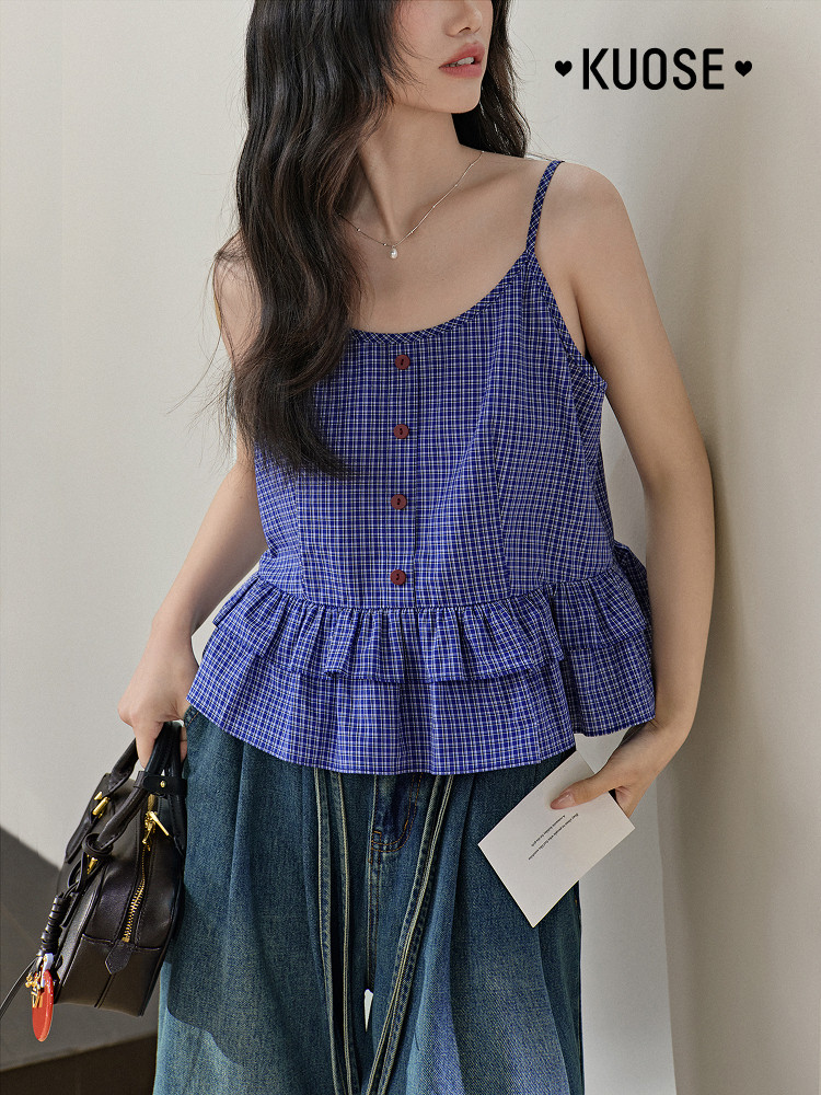 Model wearing a blue plaid sleeveless peplum top
