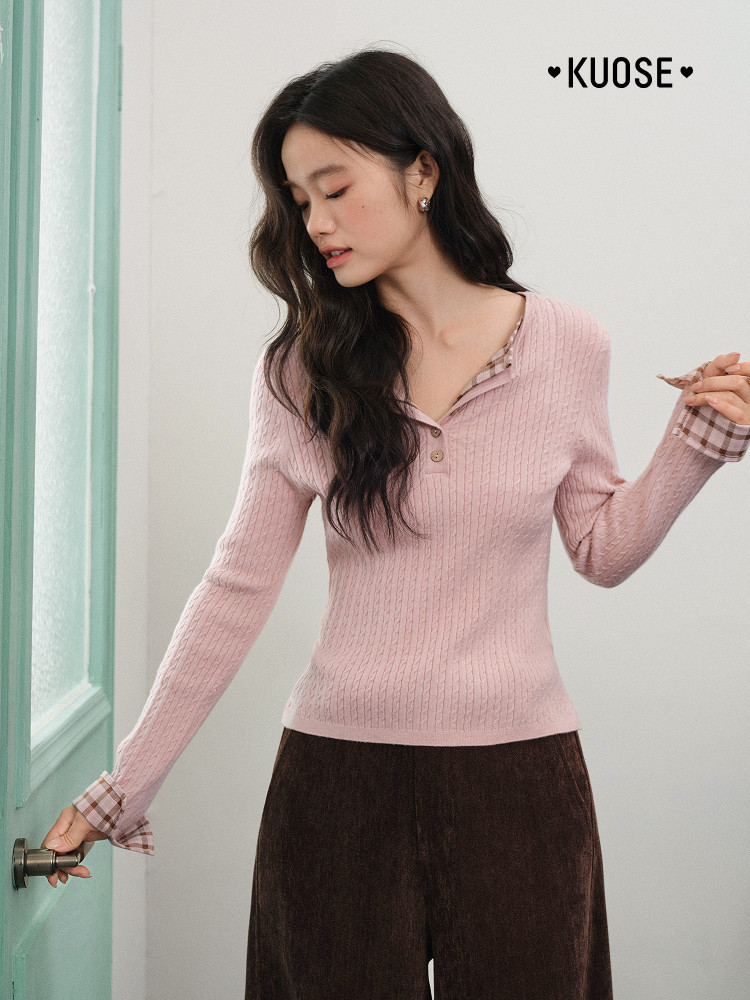Model wearing a pink ribbed long-sleeve knit top with plaid cuffs