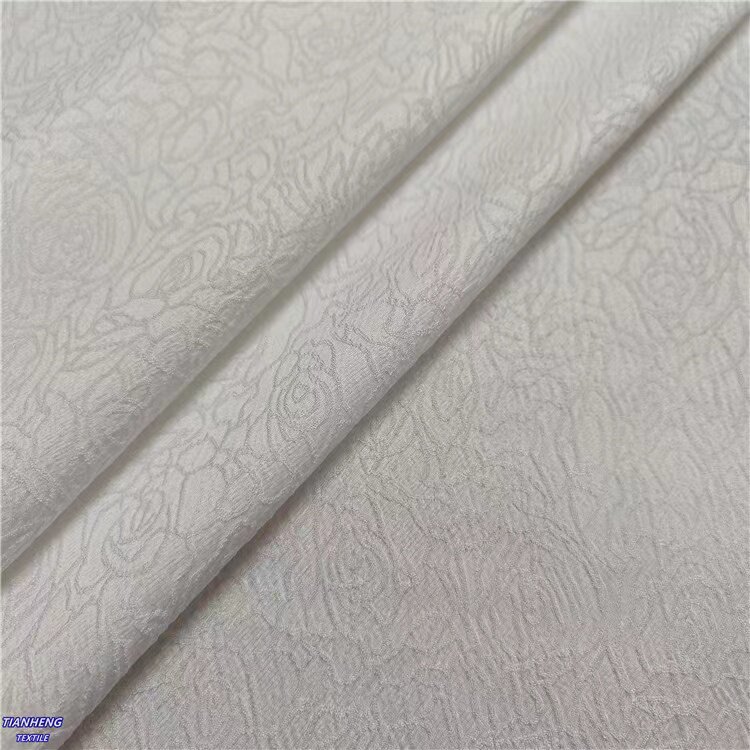 新品秋冬梭织现货暗纹玫瑰提花布改良旗袍连衣裙套装手作布料直供