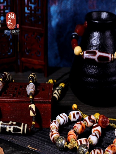 Лидер команда ювелирные украшения лотос бутылка бутылка Tiger Tiger Beads Cinnabar поставляет девять глазных овец тибетские бусины Zhenpin