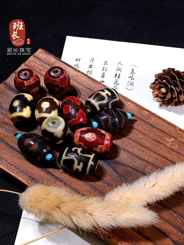 Лидер команда ювелирные украшения лотос бутылка бутылка Tiger Tiger Beads Cinnabar поставляет девять глазных овец тибетские бусины Zhenpin