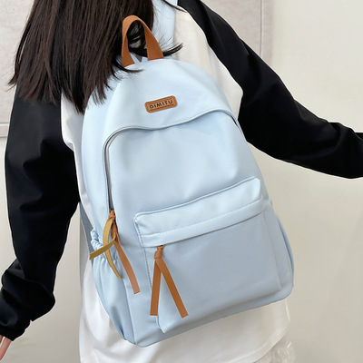 法国正品MK DN~新款初中高中生背包女纯色书包小学生大容量双肩包