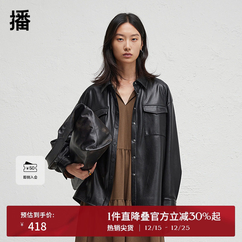 前短后长微开衩下摆，.袖口一粒扣点缀