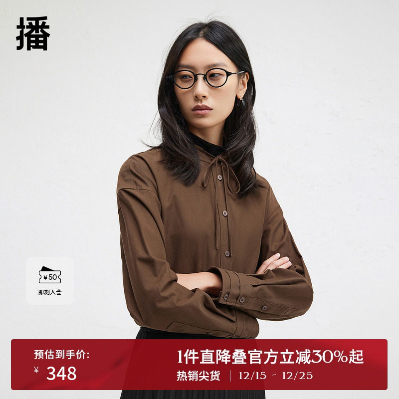 时髦串绳立领，袖口三层压褶设计