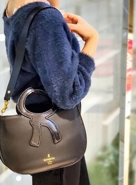 R~D~C~诺蓓达金属香槟色油蜡牛皮黑色漆皮圆环二用手提包原680