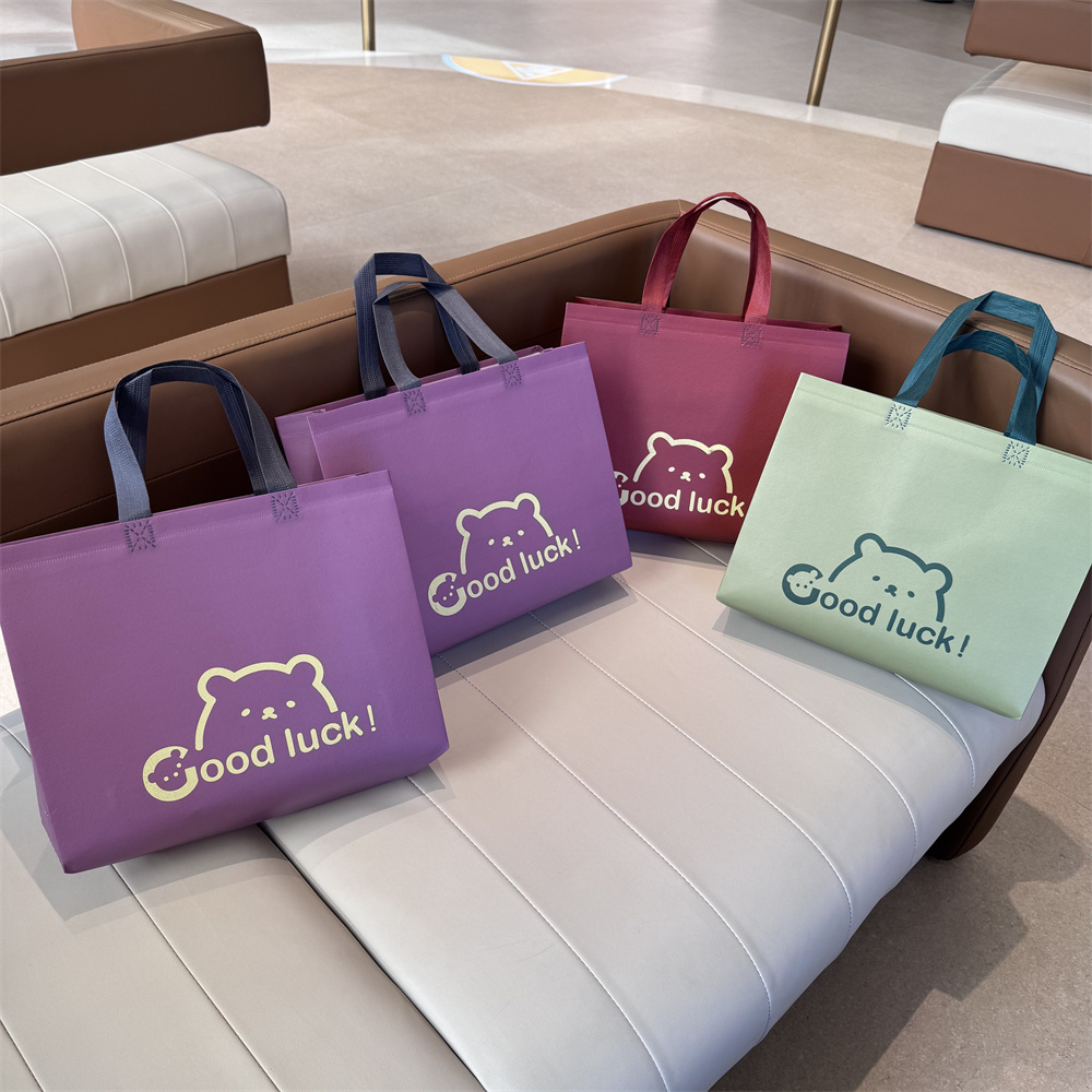 高档加厚覆膜无纺布手提袋子服装店用女装衣购物礼品包装定制logo