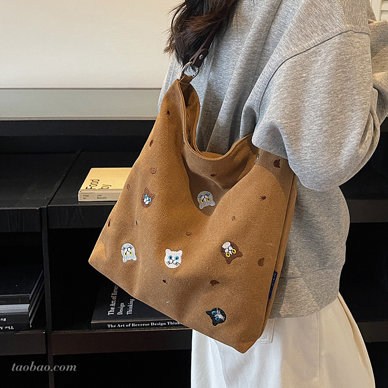 休闲大容量帆布包包女2025新款通勤百搭单肩斜挎包刺绣托特水桶包,箱包皮具/热销女包/男包,托特包,淘宝优惠券,粉丝福利购,淘宝优惠卷