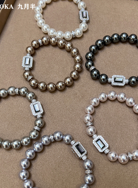 施家强光澳白大溪地黑真多麻手链