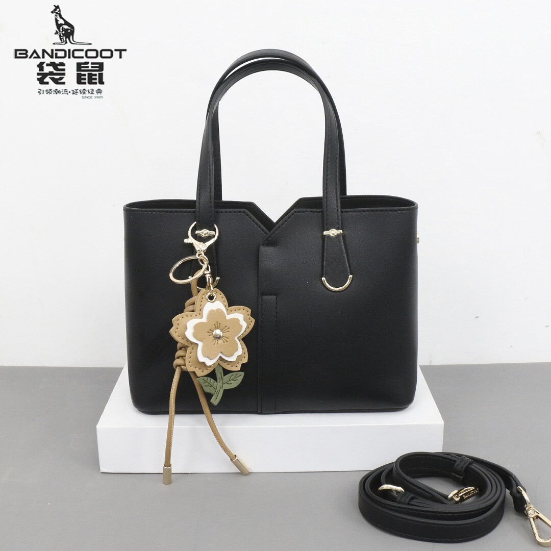 袋鼠女包手提斜挎包2026新款黑色花朵挂件托特包百搭小包印花流行