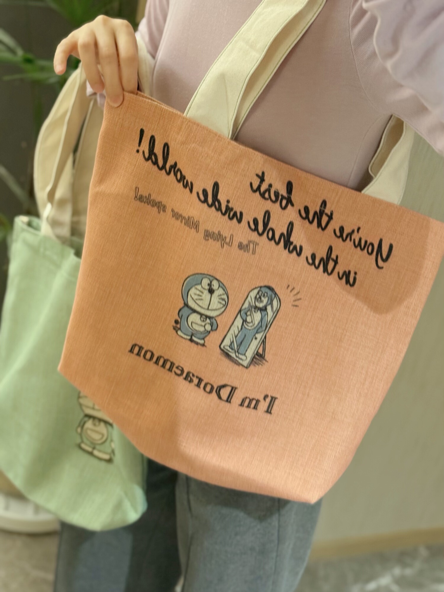 日系卡通多啦a麻料配厚实帆布拎手单肩包  正反面图案不同见详情