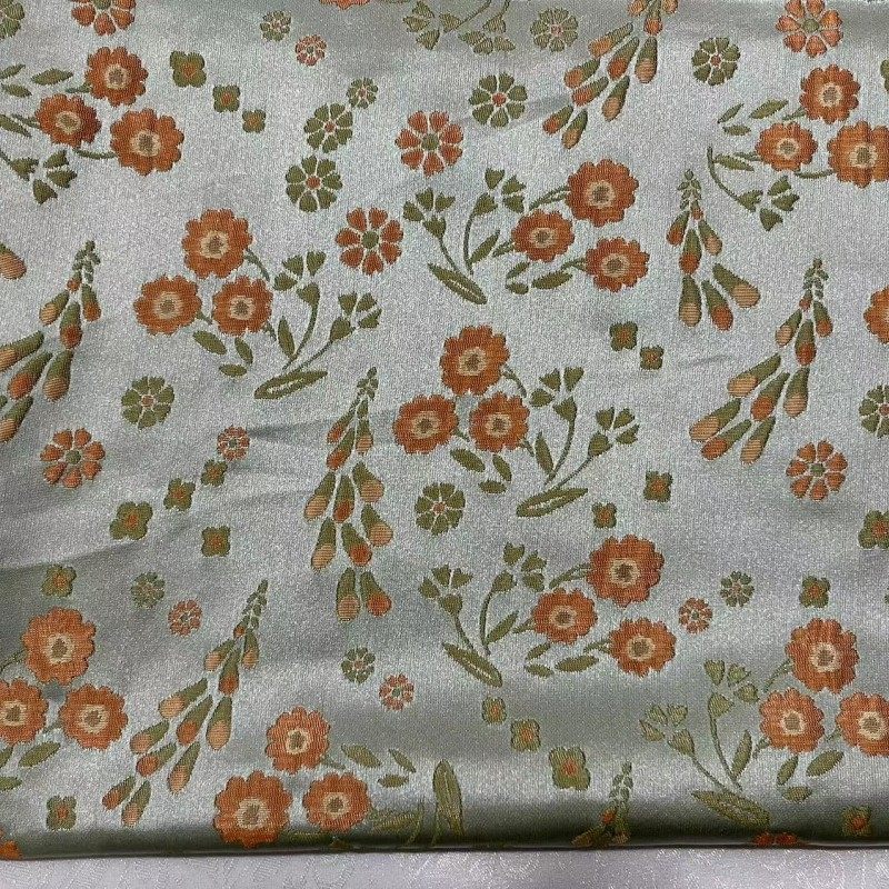 中国风小花朵水草提花面料 微括橘粉色织提花布缎面女装箱包布料,居家布艺,海绵垫/布料/面料/手工diy,淘宝优惠券,粉丝福利购,淘宝优惠卷