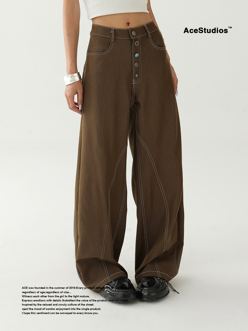 Brown wide-leg pants worn by a model on a white background