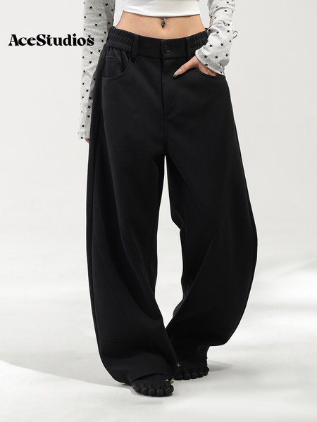 Black oversized baggy pants worn by a model.