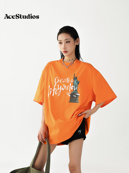 Orange oversized graphic T-shirt worn by a model