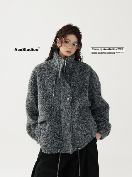 Model wearing a gray fuzzy zip-up jacket