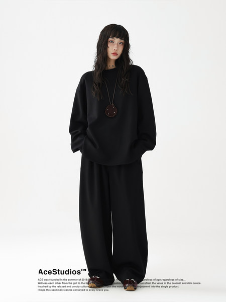 Black oversized sweatshirt and wide-leg pants worn by a model