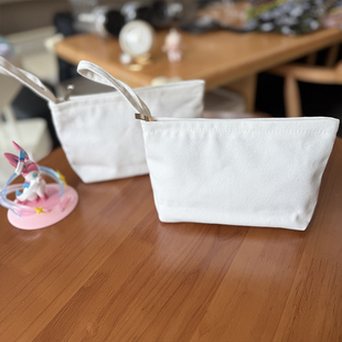白色帆布包包收纳小包手拎小布袋新款护肤品化妆包便携文艺笔袋