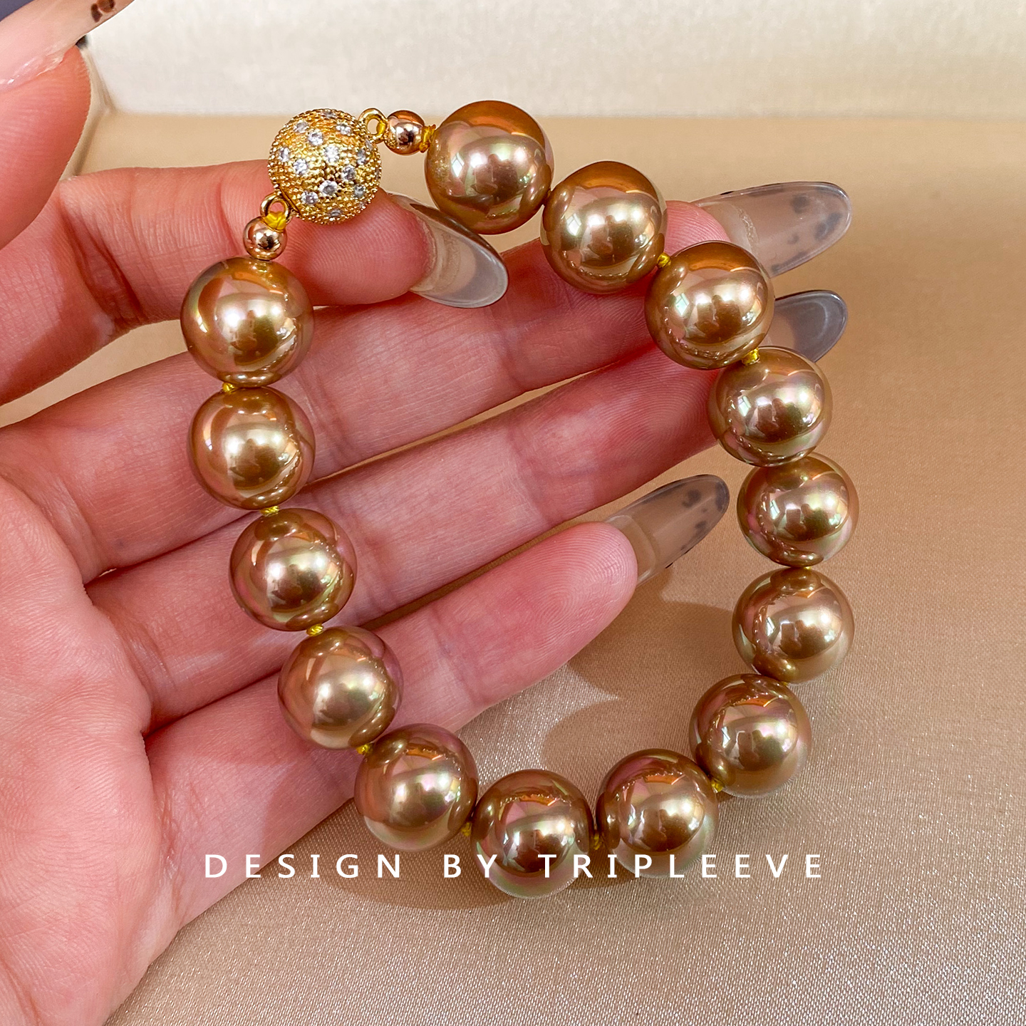 月光彩虹浓茶金！绿紫伴彩南洋金珠仿海水珍珠手链棉线打结手环